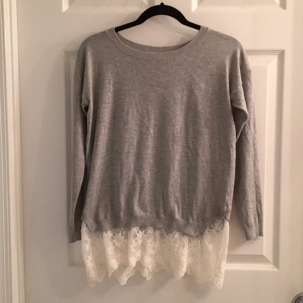Grey sweater with lace underlay